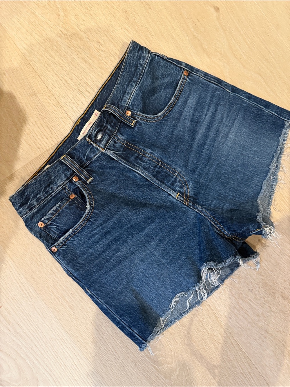 Levi's Dark Blue Denim Ribcage Shorts with Orange Stitching